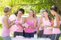 Smiling women organising event for breast cancer awareness Royalty Free Stock Photo