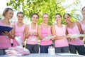 Smiling women organising event for breast cancer awareness Royalty Free Stock Photo