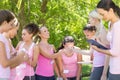 Smiling women organising event for breast cancer awareness Royalty Free Stock Photo