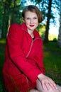 Smiling women in red raincoat Royalty Free Stock Photo