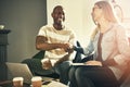 Smiling work colleagues shaking hands in a stylish modern office Royalty Free Stock Photo