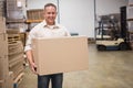 Smiling worker carrying a box Royalty Free Stock Photo
