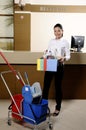 Smiling worker cleaning the hotel