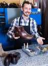 Smiling worker displaying result of his work Royalty Free Stock Photo