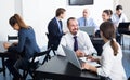 Smiling workers having a productive day at work Royalty Free Stock Photo