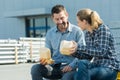 smiling workers outside factory having lunch Royalty Free Stock Photo