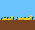 A smiling yellow worm crawling on the ground in a vegetable field - illustration