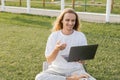 smiling yoga man talking near laptop