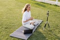 smiling yoga teacher sitting in easy