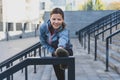 Young adult sporty girl stretching outdoor in city Royalty Free Stock Photo