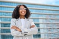 Smiling young African American business woman standing in city looking away. Royalty Free Stock Photo