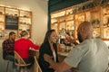 Smiling African American couple enjoying drinks together in a bar Royalty Free Stock Photo