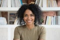 Smiling young african american woman looking at camera webcam Royalty Free Stock Photo