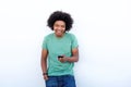 Smiling young african american man with cell phone Royalty Free Stock Photo