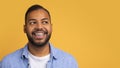 Smiling young african american man with orthodontic braces looking at copy space Royalty Free Stock Photo