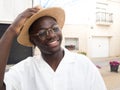 Smiling young african american man wearing a hat outdoors Royalty Free Stock Photo