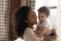 Loving African American mother cuddle with baby daughter Royalty Free Stock Photo