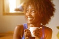 Smiling young african american woman with coffee cup Royalty Free Stock Photo