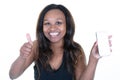 Smiling young african american woman posing isolated on white background holding mobile phone with blank empty screen showing Royalty Free Stock Photo