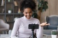 Smiling African American woman record video on cellphone Royalty Free Stock Photo