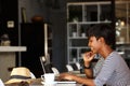 Smiling young african american woman working on laptop Royalty Free Stock Photo