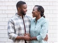 Affectionate young African couple standing together in the city Royalty Free Stock Photo