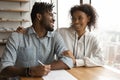 Happy black spouses support one another in signing contract Royalty Free Stock Photo