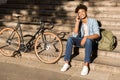 Smiling young african man with backpack outdoors Royalty Free Stock Photo