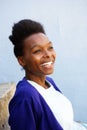 Smiling young african woman sitting outdoors Royalty Free Stock Photo