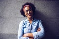 Smiling young African woman standing with her arms crossed Royalty Free Stock Photo