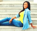 Smiling young african woman wearing a jeans clothes Royalty Free Stock Photo