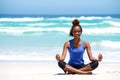 Smiling young african woman in yoga pose Royalty Free Stock Photo