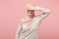 Smiling young arabian muslim girl in hijab light clothes posing isolated on pink wall background studio portrait. People Royalty Free Stock Photo