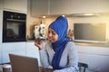 Smiling young Arabic female entrepreneur working online in her k Royalty Free Stock Photo