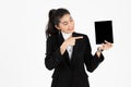 Smiling young Asian business woman holding digital tablet for her work over white isolated background Royalty Free Stock Photo