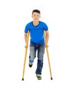 Smiling Young asian man on crutches. Royalty Free Stock Photo