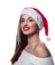 Smiling Young beautiful Santa girl. Fashionable luxury girl celebrating New Year.