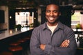 Smiling Young Black Male Standing In Office Looking At Camera With Arms Crossed Royalty Free Stock Photo