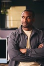 Smiling Young Black Male Standing In Office Looking Away From Camera With Arms Crossed Royalty Free Stock Photo