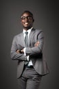 Smiling young black man with glasses and gray business suit Royalty Free Stock Photo