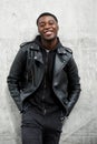 Smiling young black man in leather jacket Royalty Free Stock Photo