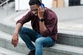 Smiling young black man listening music headphones Royalty Free Stock Photo