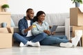 Smiling Young Black Spouses With Digital Tablet And Credit Card Shopping Online