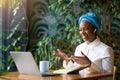 Smiling young black woman employee have online meeting with colleagues Royalty Free Stock Photo