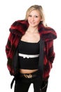Smiling young blond woman in a fur jacket Royalty Free Stock Photo