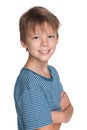 Smiling young boy in a blue shirt