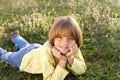Smiling young boy lying on grass Royalty Free Stock Photo