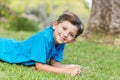 Smiling young boy lying on grass Royalty Free Stock Photo