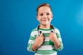 Smiling young boy posing with headphone and looking away Royalty Free Stock Photo