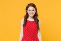 Smiling young brunette woman girl in red summer dress, crown posing isolated on yellow wall background studio portrait Royalty Free Stock Photo